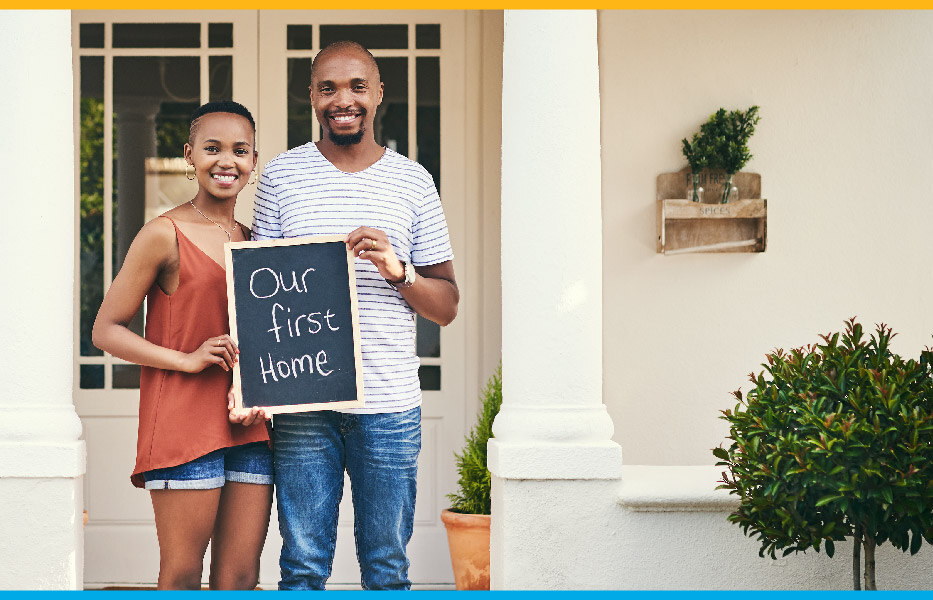 Black first time homebuyer couple standing outside their new home